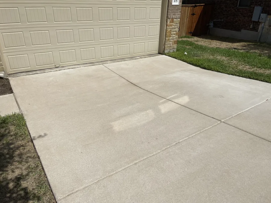 The same driveway after pressure washing
