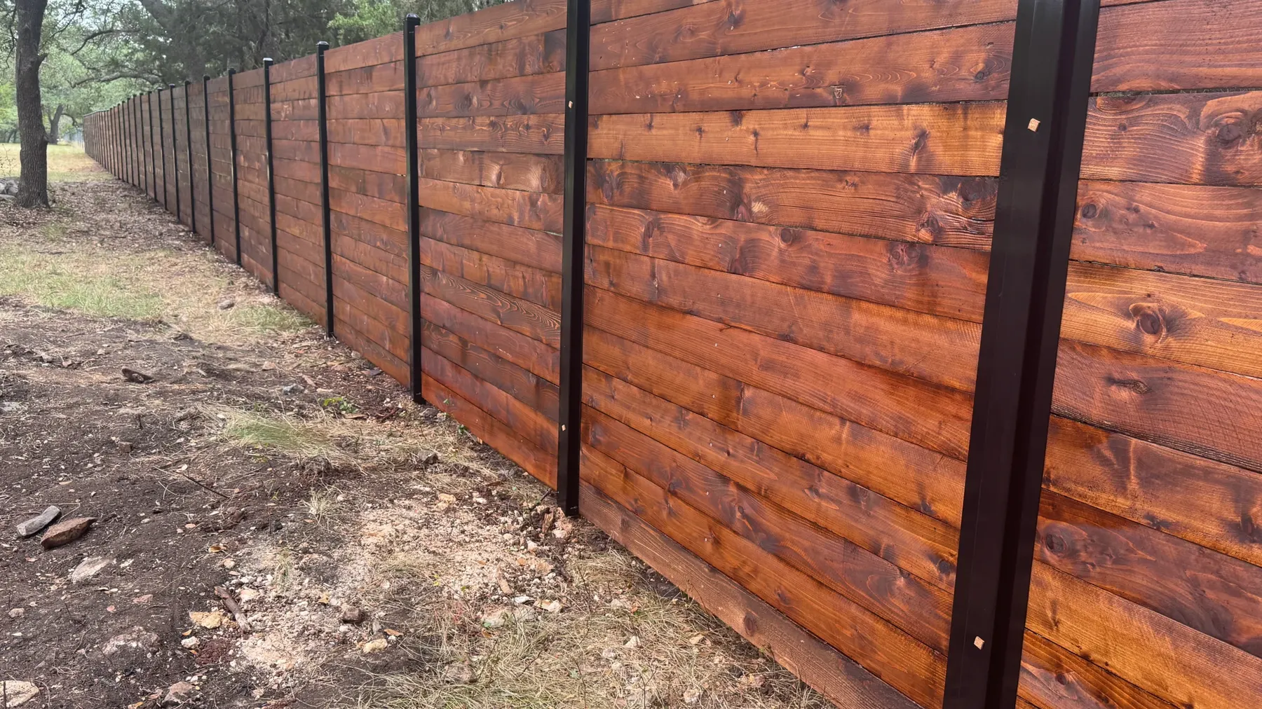 Horizontal cedar fence stained by Stain Guys in Georgetown, TX